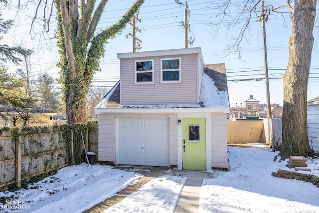 view of snow covered garage