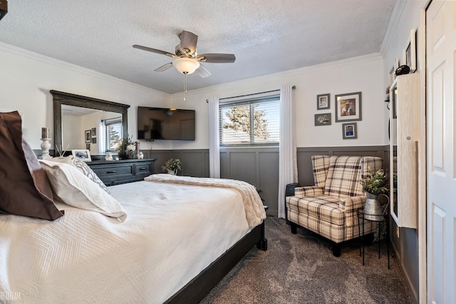 carpeted bedroom with crown molding, ceiling fan, and a textured ceiling