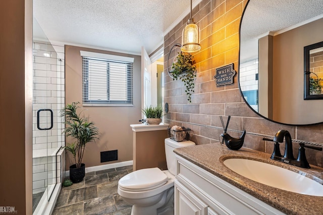 bathroom with a shower with door, ornamental molding, a textured ceiling, and toilet