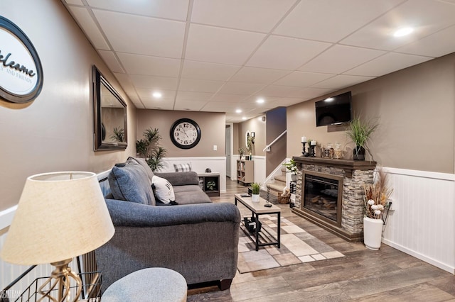 living room with hardwood / wood-style flooring and a fireplace