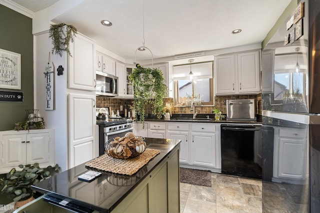 kitchen with stainless steel appliances, a center island, white cabinets, and decorative backsplash