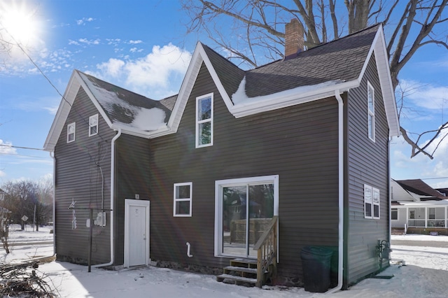 view of snow covered house