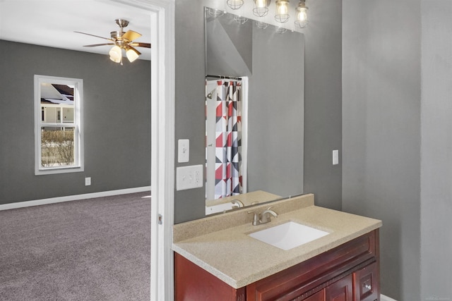 bathroom featuring ceiling fan and vanity