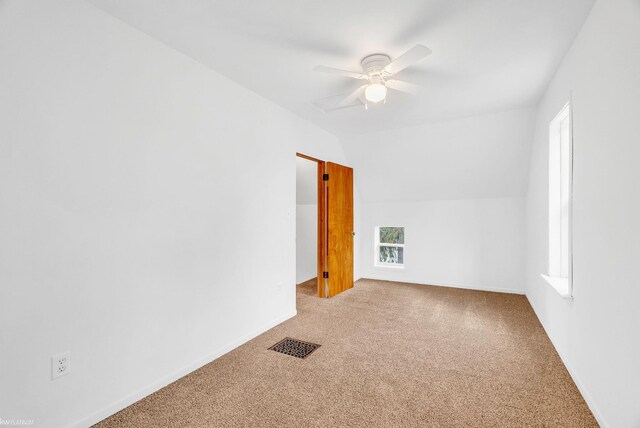 bonus room featuring ceiling fan, vaulted ceiling, and carpet