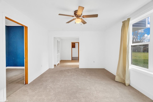 carpeted empty room with ceiling fan