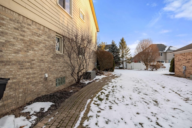 view of yard layered in snow