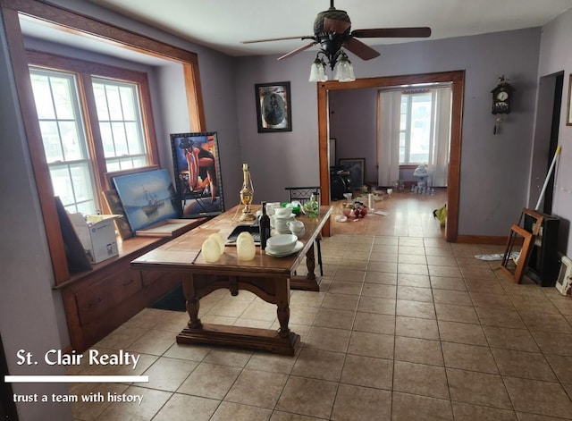 interior space with light tile patterned floors and ceiling fan