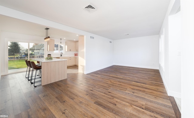 interior space with sink and dark wood-type flooring