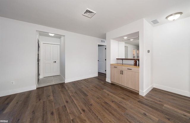 interior space with dark wood-type flooring