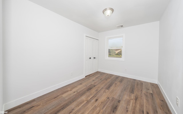 empty room featuring hardwood / wood-style floors