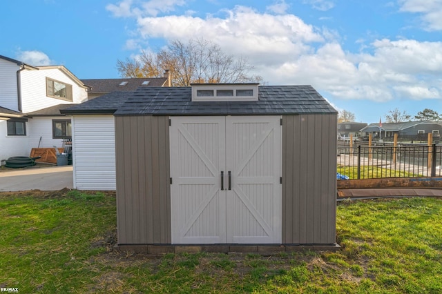 view of outdoor structure featuring a yard