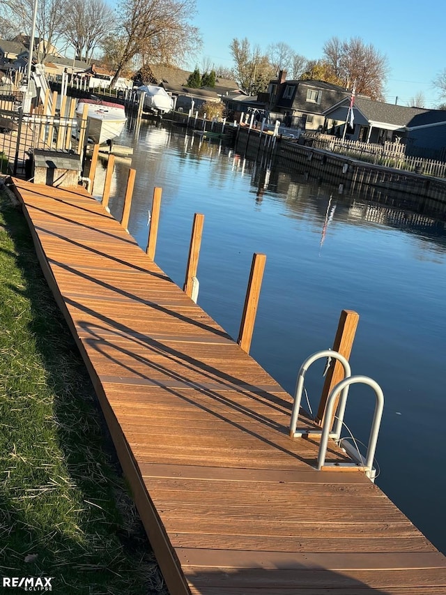 dock area with a water view