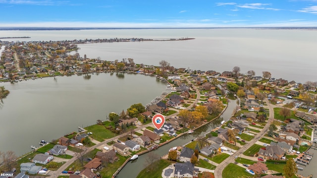 birds eye view of property featuring a water view