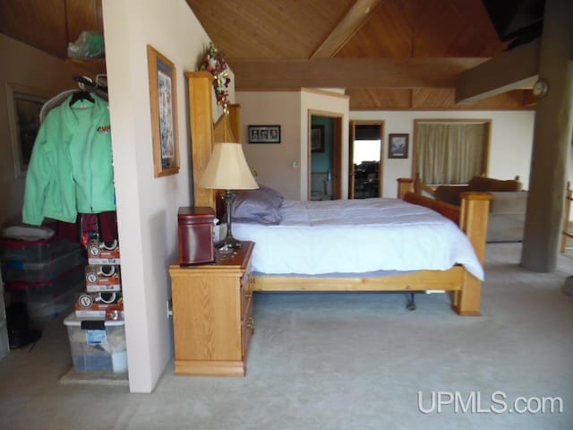 bedroom with wood ceiling, carpet flooring, and lofted ceiling with beams