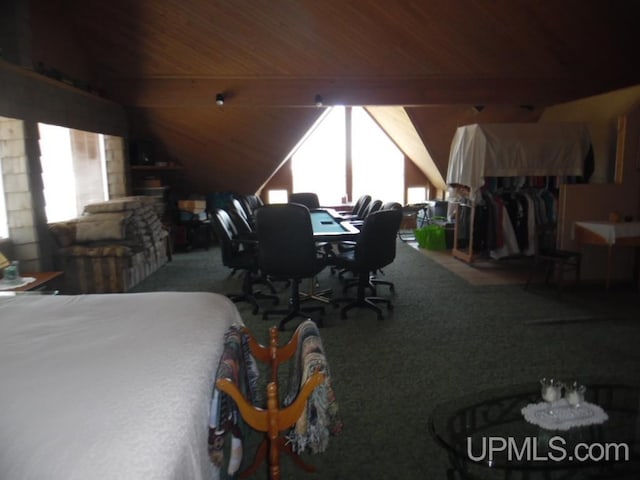 bedroom with vaulted ceiling with beams and wooden ceiling