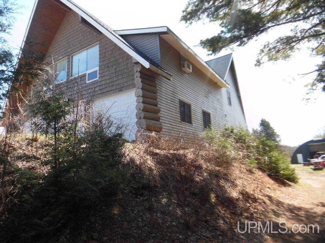 view of side of property featuring a garage