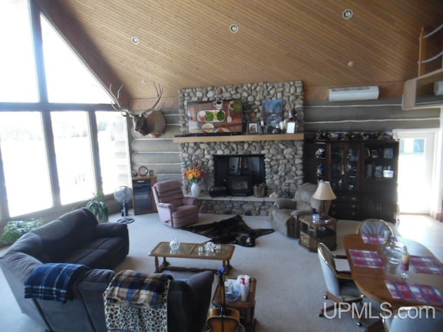 living room with an AC wall unit, carpet floors, and wooden ceiling