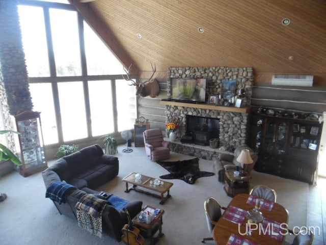 living room featuring wood ceiling, plenty of natural light, a fireplace, and carpet