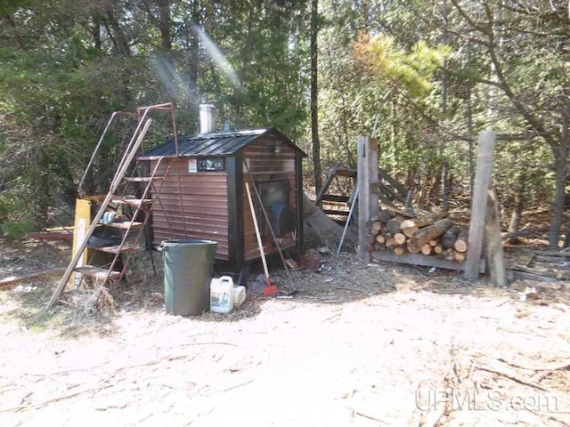 view of jungle gym featuring a storage shed