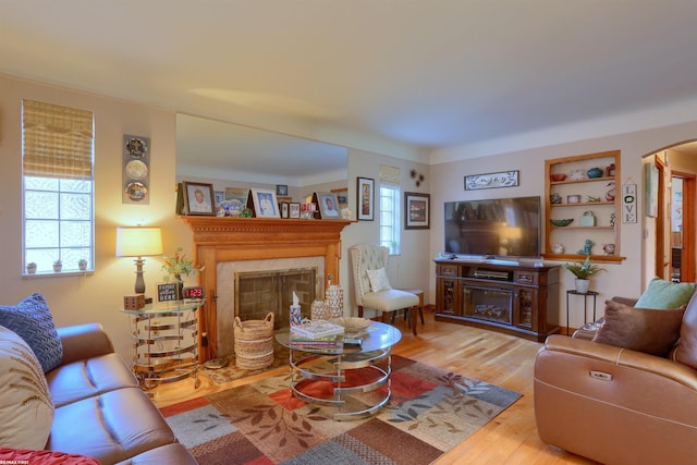 living room with hardwood / wood-style floors and a fireplace