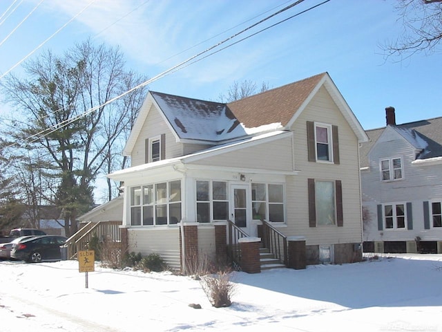 view of front facade featuring a sunroom