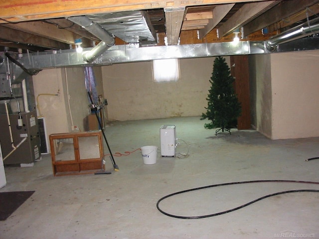 basement featuring heating unit