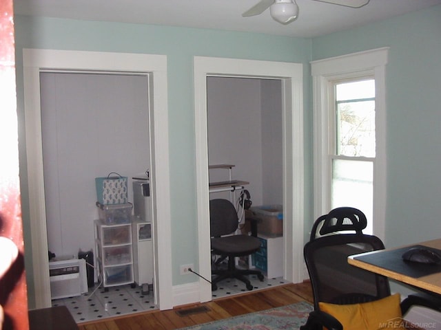 office space featuring hardwood / wood-style floors and ceiling fan