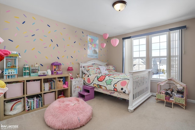 bedroom with multiple windows and carpet floors