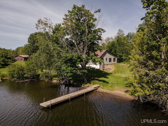 dock area featuring a water view and a lawn