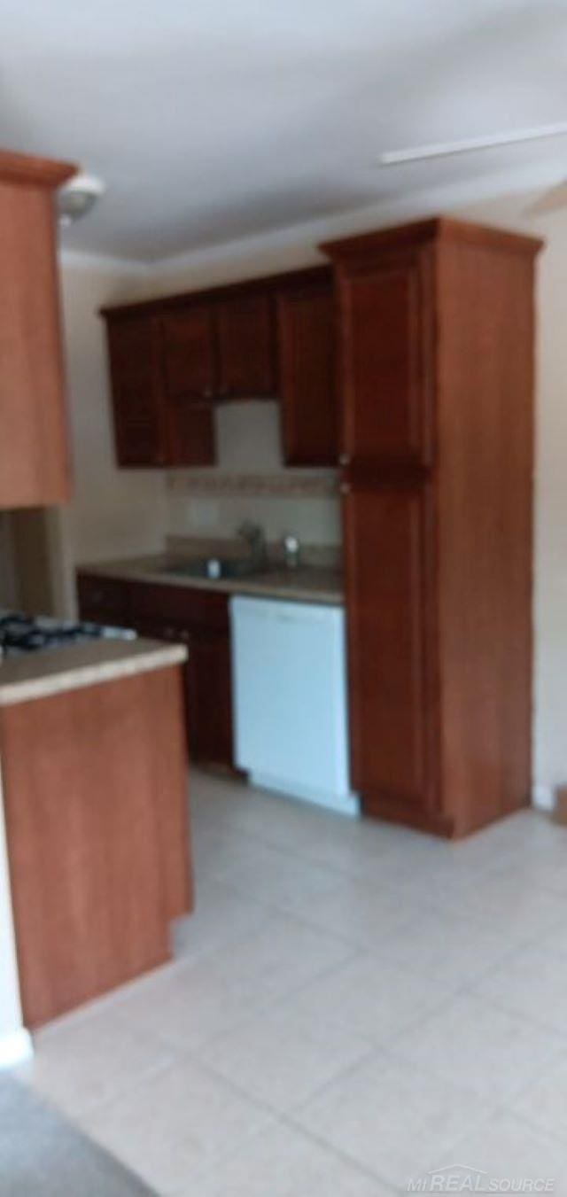 kitchen featuring sink and white gas cooktop