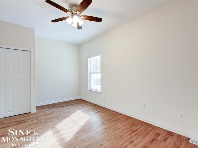 unfurnished bedroom with ceiling fan and light hardwood / wood-style floors