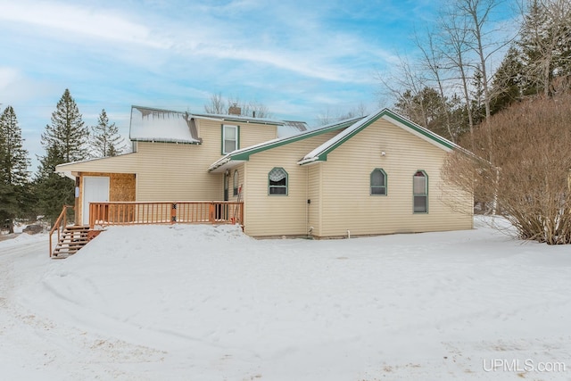 view of snow covered house