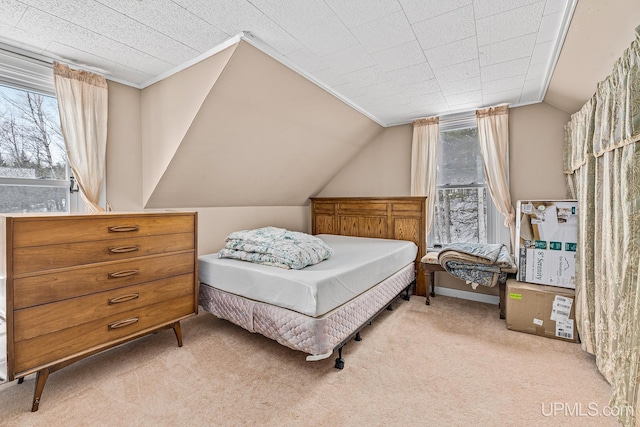 carpeted bedroom featuring vaulted ceiling