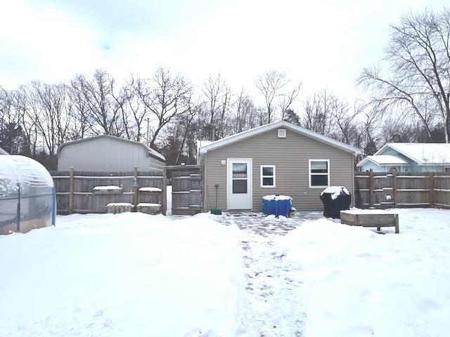 view of snow covered house