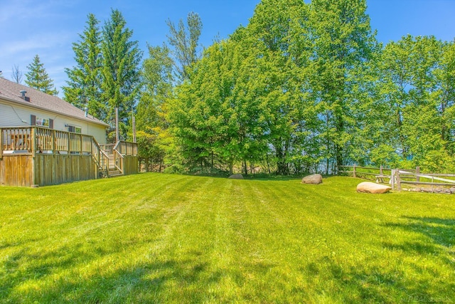 view of yard featuring a deck