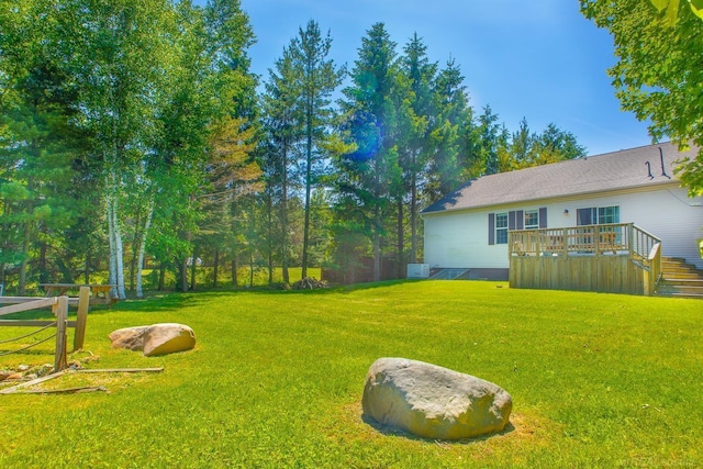 view of yard with a deck