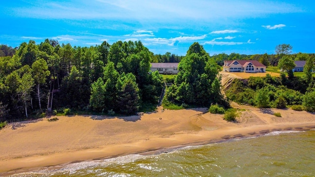 bird's eye view with a water view and a view of the beach