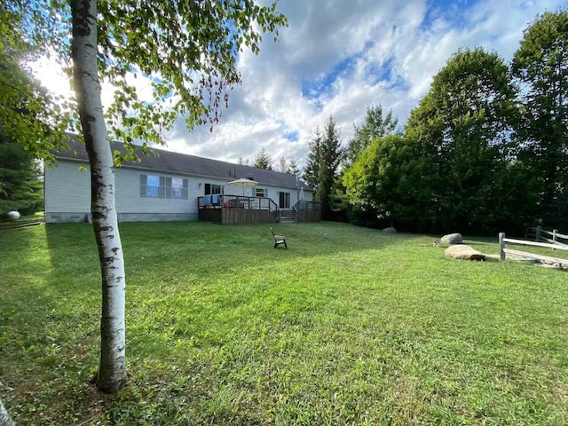 view of yard featuring a deck