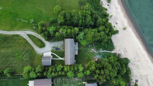 birds eye view of property featuring a view of the beach and a water view