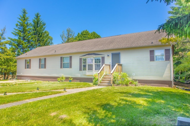 ranch-style house with a front lawn