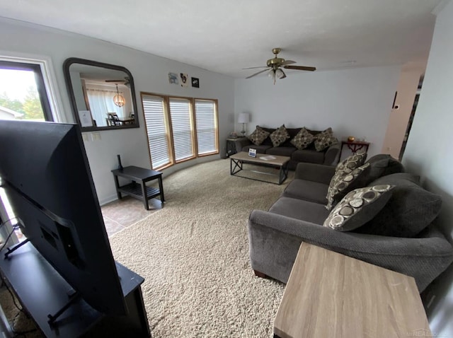 carpeted living room featuring ceiling fan