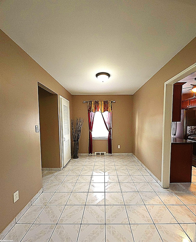 unfurnished dining area with ceiling fan