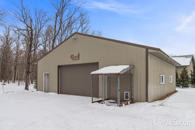 view of snow covered garage