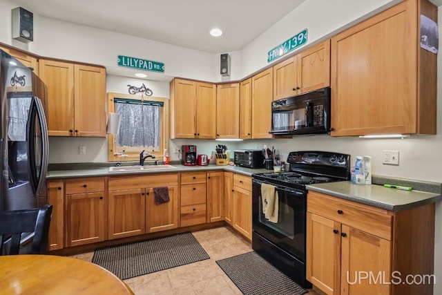 kitchen featuring sink and black appliances