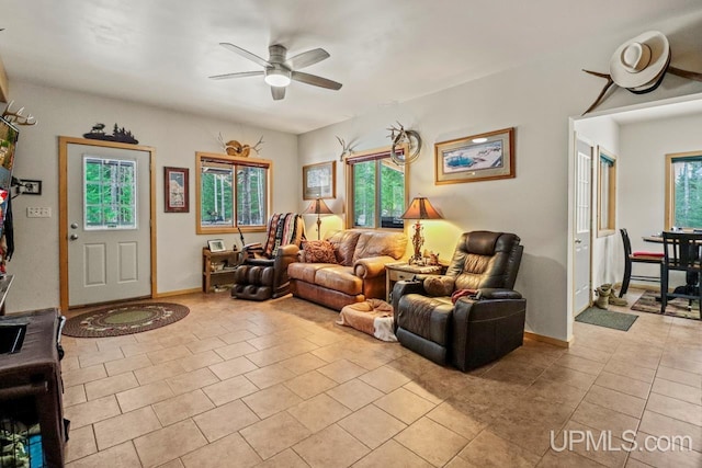 tiled living room featuring ceiling fan