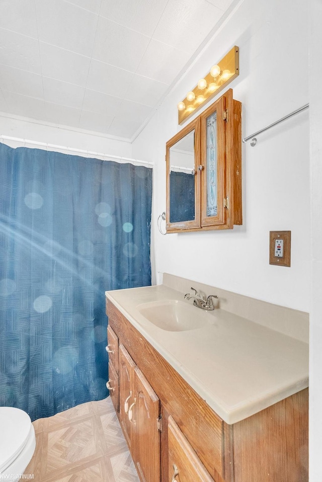 bathroom with vanity and toilet