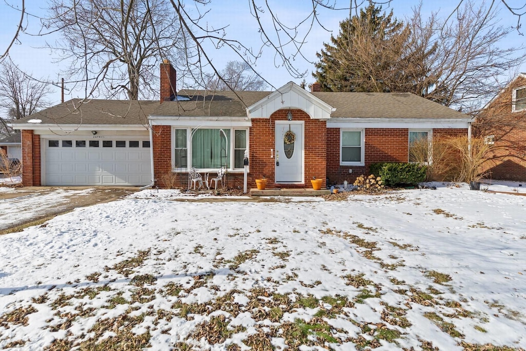 single story home featuring a garage