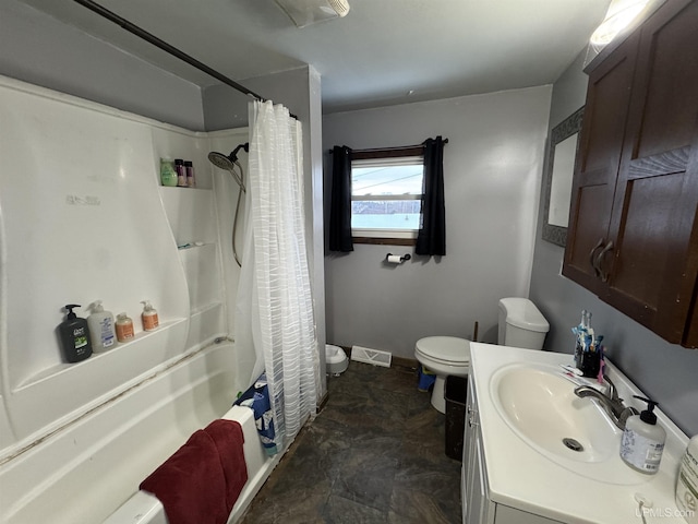 full bathroom with shower / bath combination with curtain, vanity, and toilet