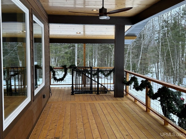 snow covered deck featuring ceiling fan