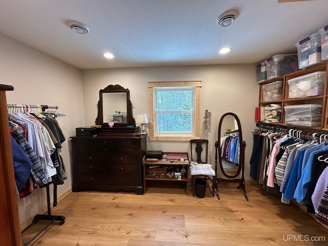 walk in closet featuring light wood-type flooring